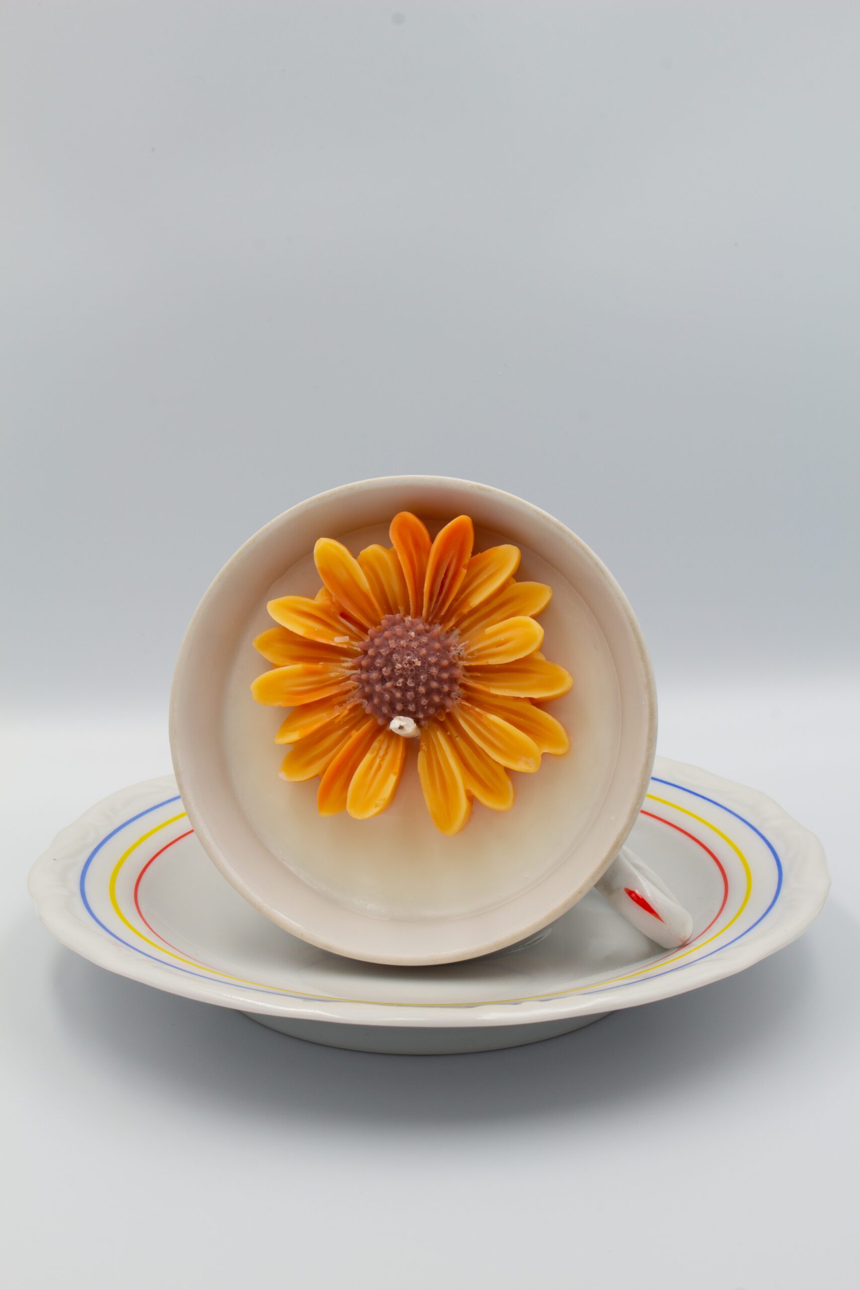 gruszka jabłko świeca w filiżance